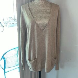 Halston Heritage women's long sleeves sweater with pockets on front.  Medium